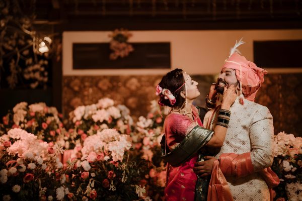 man-woman-are-standing-front-bunch-flowers man-woman-are-standing-front-bunch-flowers